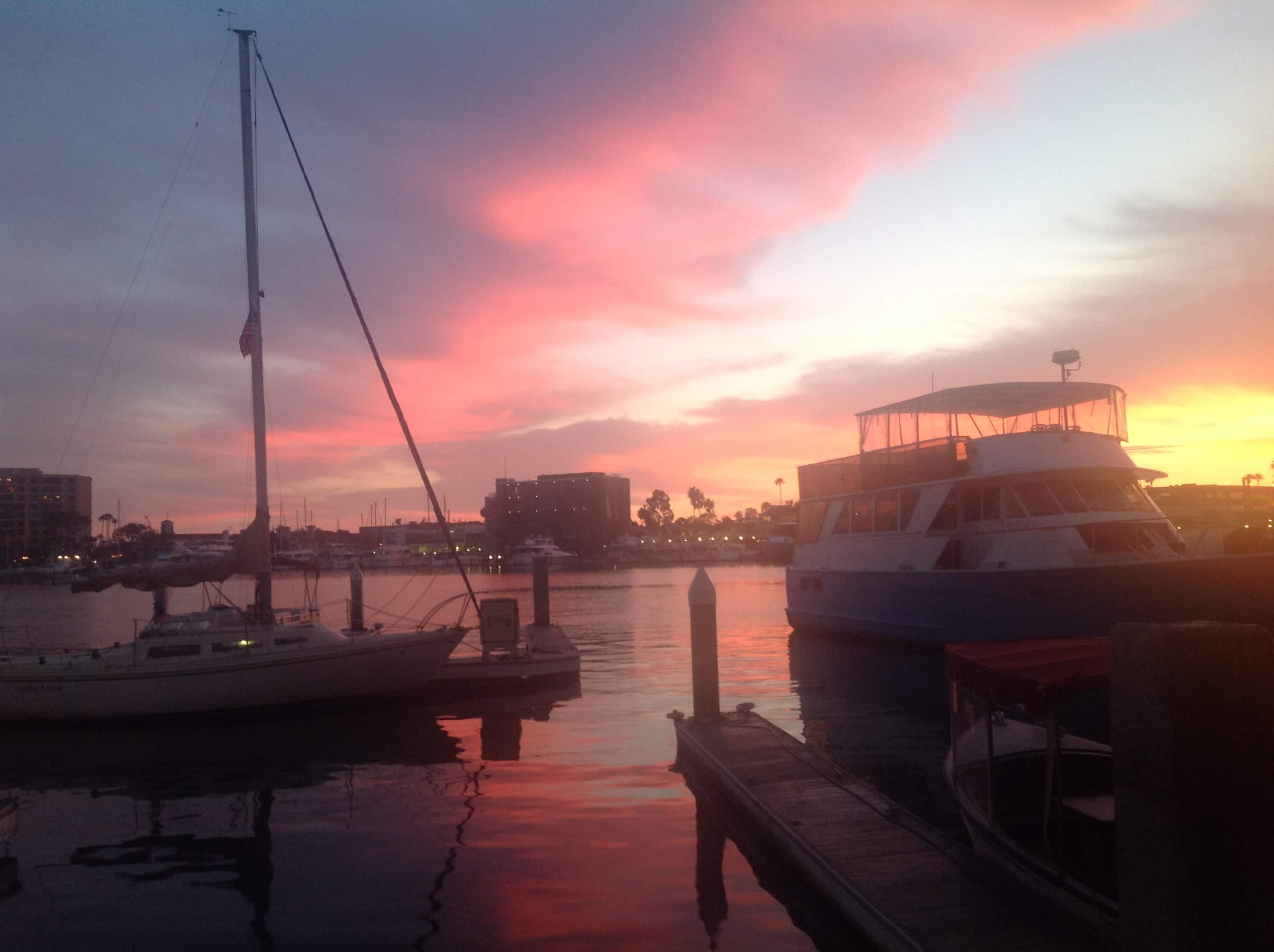 Newport Beach harbor boats at sunset